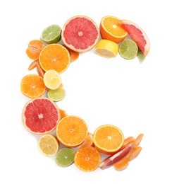 Photo of Letter C made with citrus fruits on white background as vitamin representation, top view