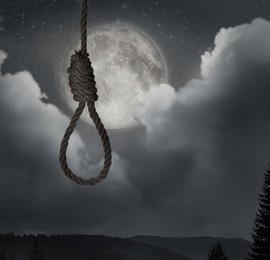 Rope noose with knot outdoors on full moon night