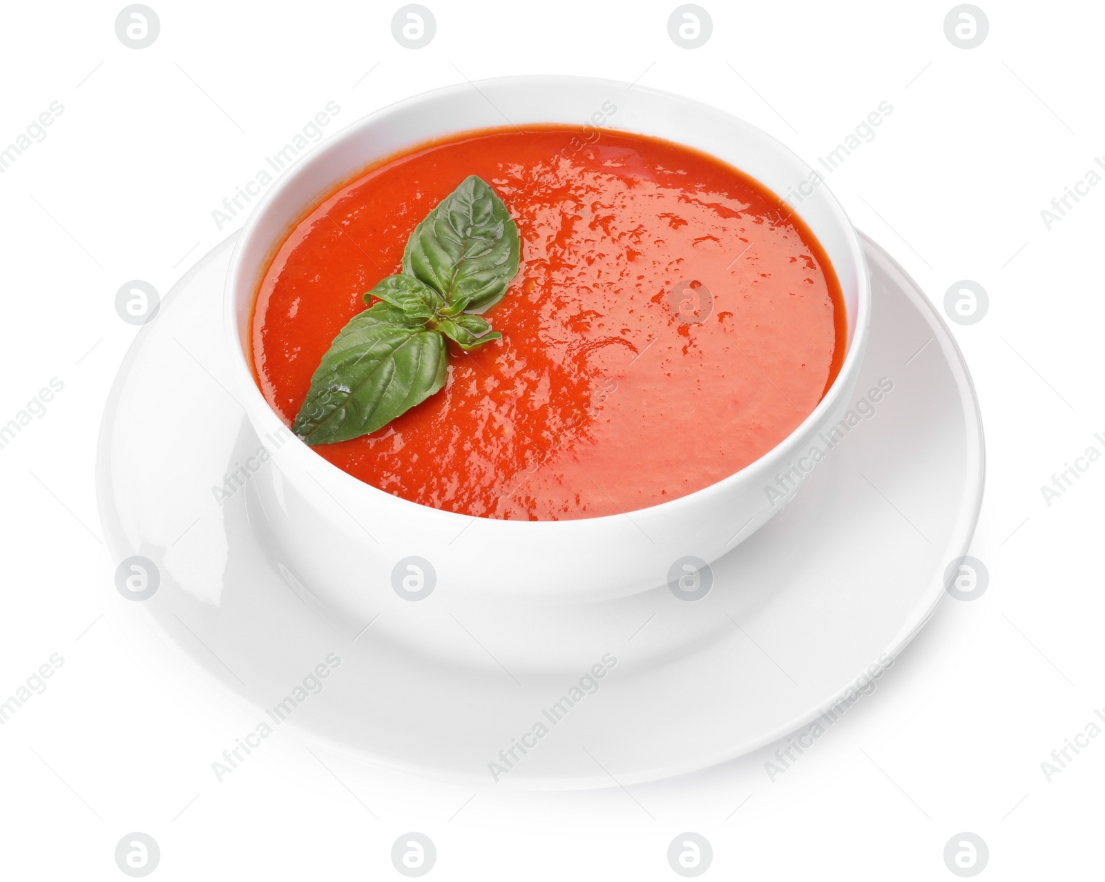 Photo of Delicious tomato soup with basil isolated on white