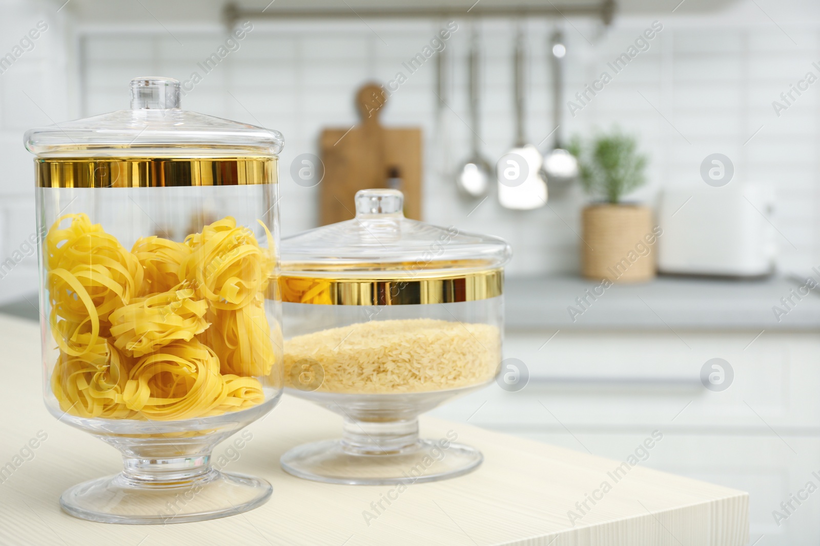 Photo of Products on wooden table in modern kitchen