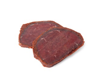 Photo of Delicious dry-cured beef basturma slices on white background