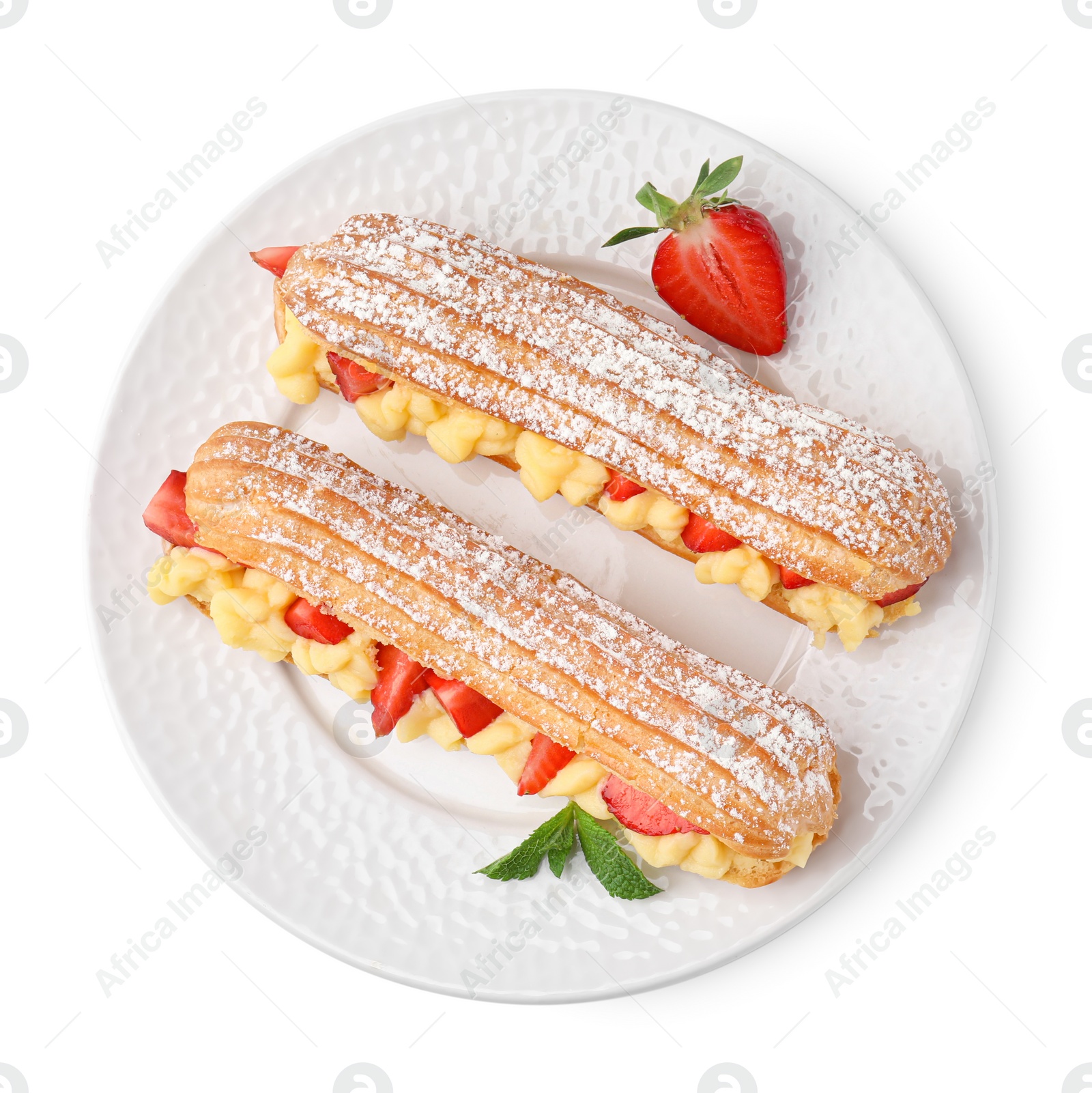 Photo of Delicious eclairs filled with cream, strawberries and mint isolated on white, top view