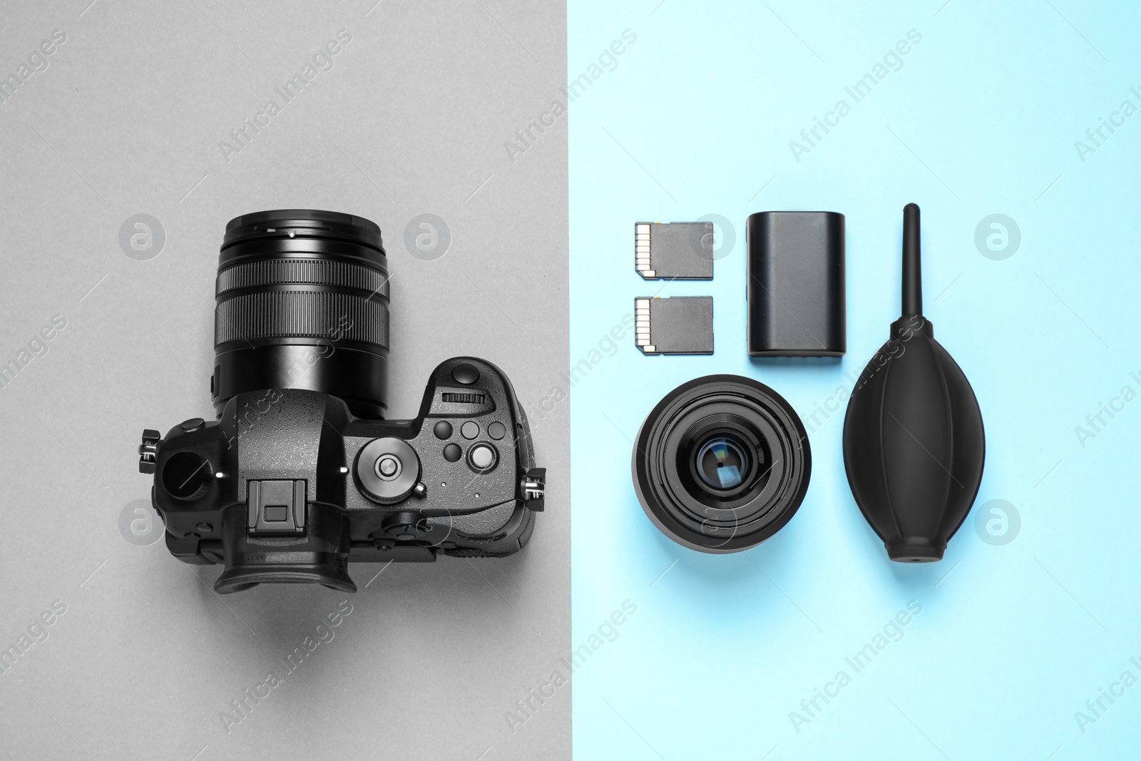 Photo of Flat lay composition with camera and video production equipment on color background