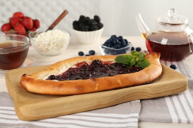 Delicious sweet cottage cheese pastry with cherry jam served on table