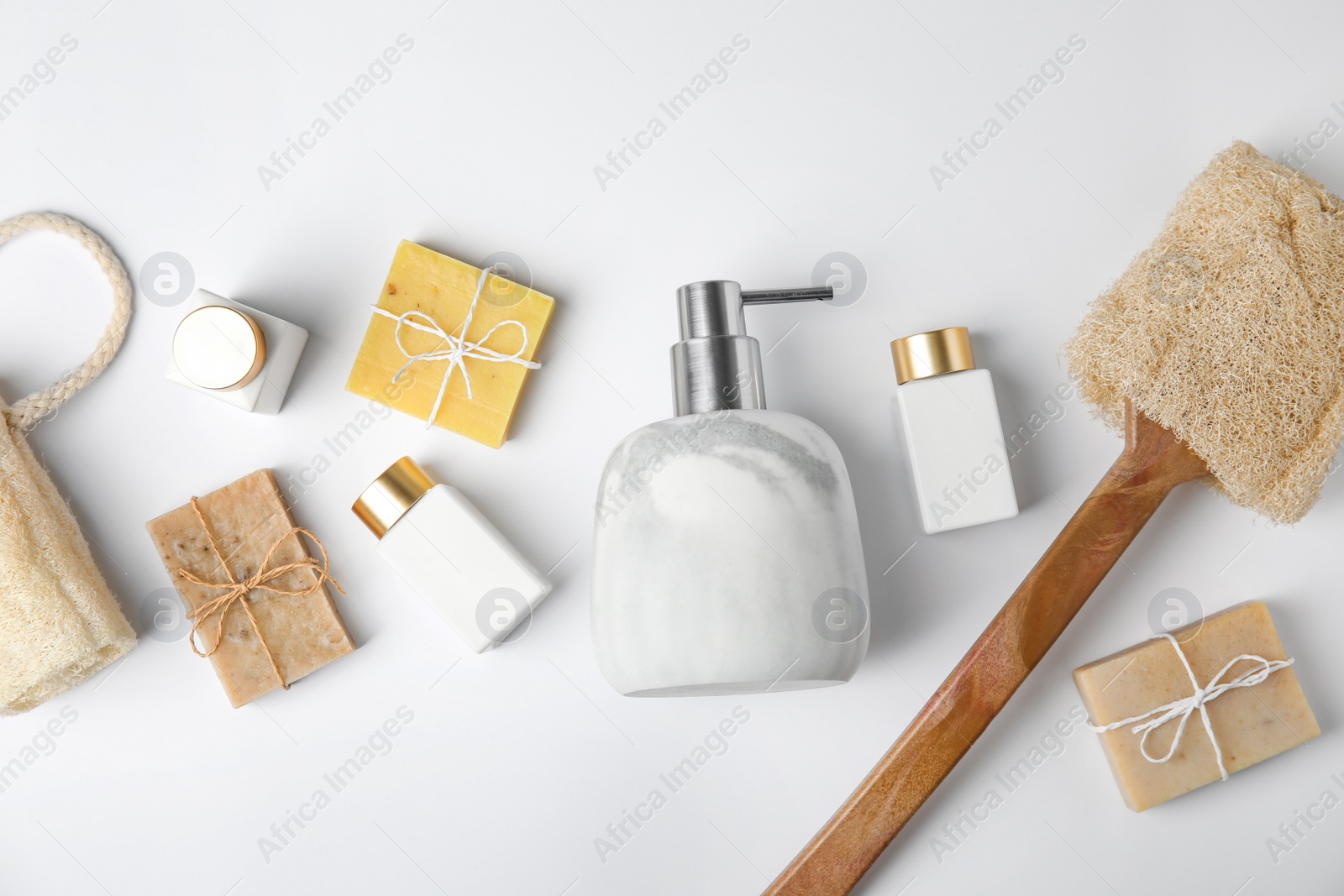 Photo of Flat lay composition with marble soap dispenser on white background