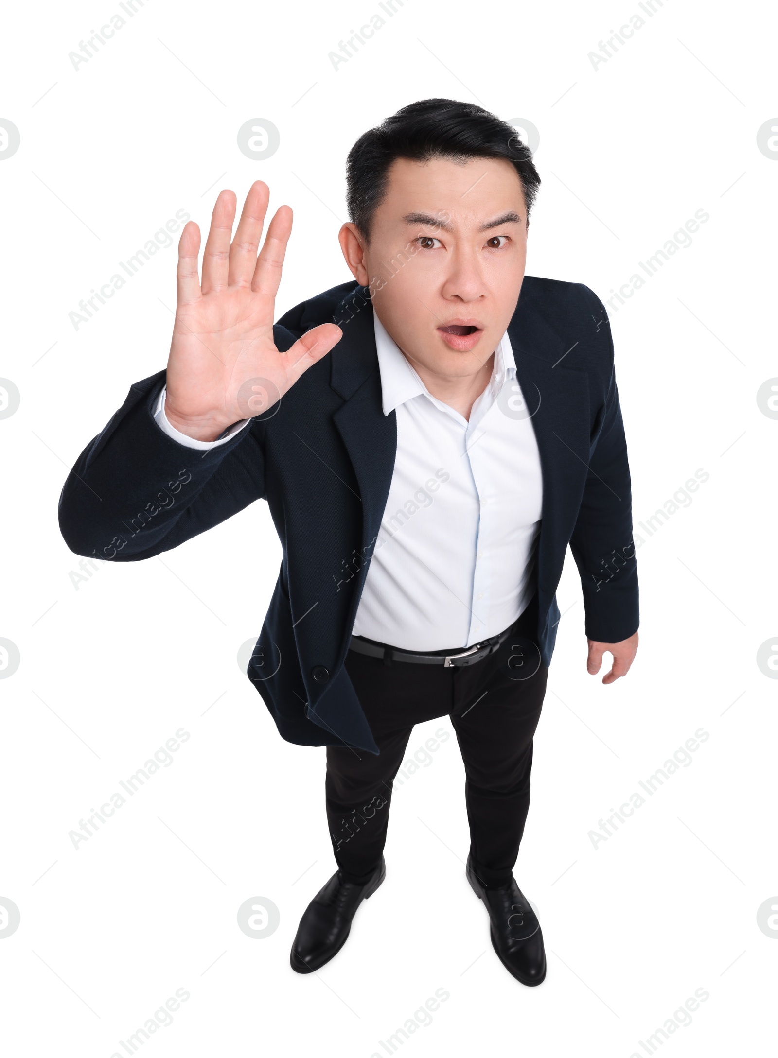 Photo of Businessman in suit posing on white background, above view