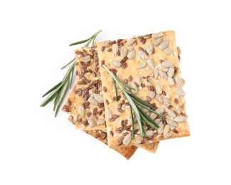 Photo of Stack of cereal crackers with flax, sunflower, sesame seeds and rosemary isolated on white, top view