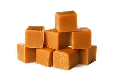 Photo of Heap of caramel candies on white background