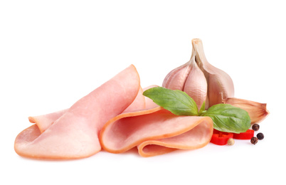 Photo of Slices of tasty fresh ham with basil, vegetables and pepper isolated on white