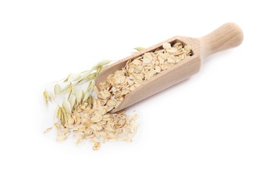 Photo of Scoop with oatmeal and floret branches isolated on white