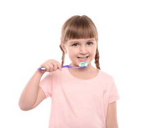 Photo of Little girl brushing teeth on white background