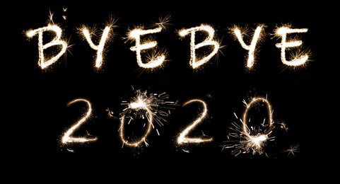 Image of Bye Bye 2020. Bright text made of sparkler on black background, banner design 