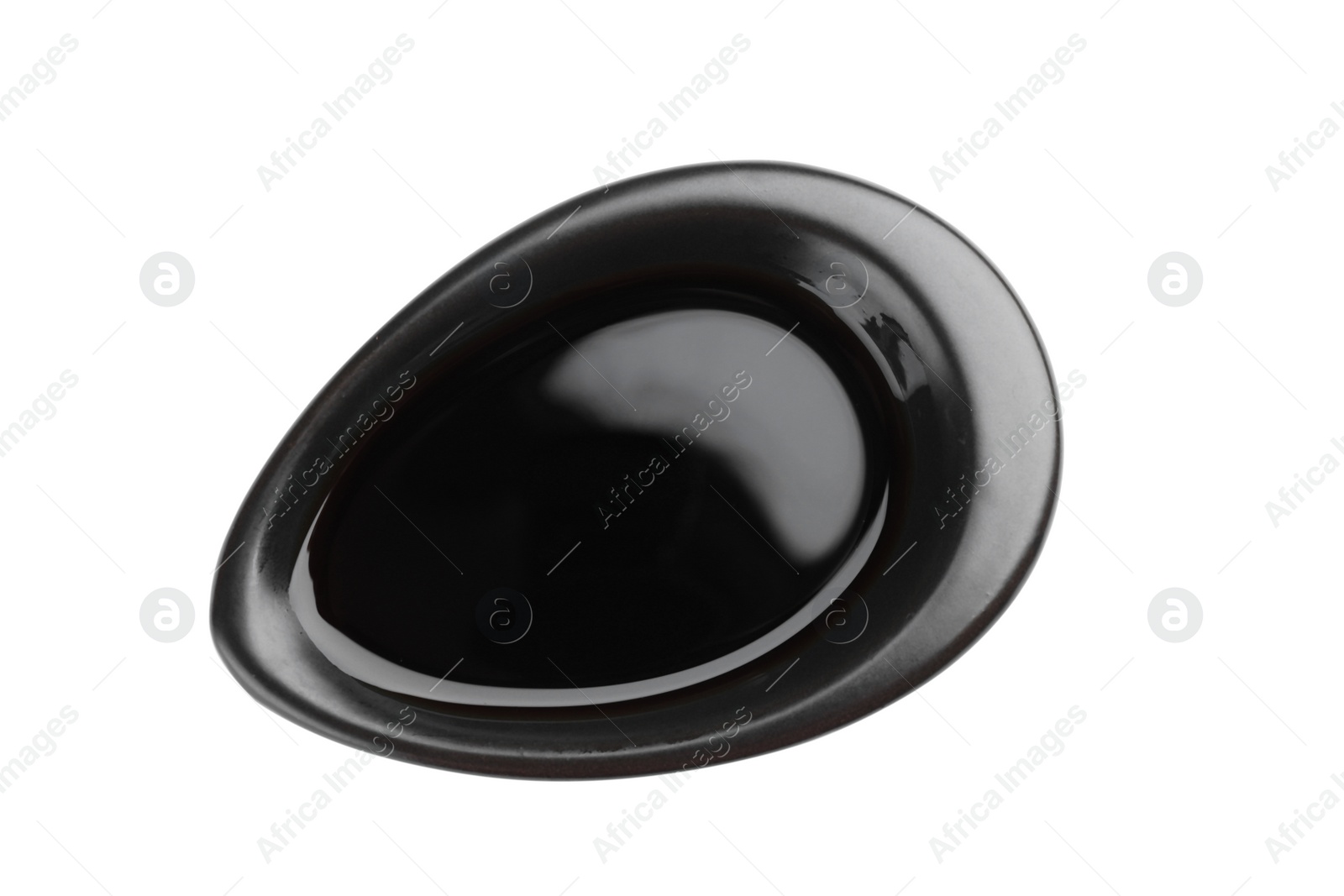 Photo of Bowl of tasty soy sauce isolated on white, top view