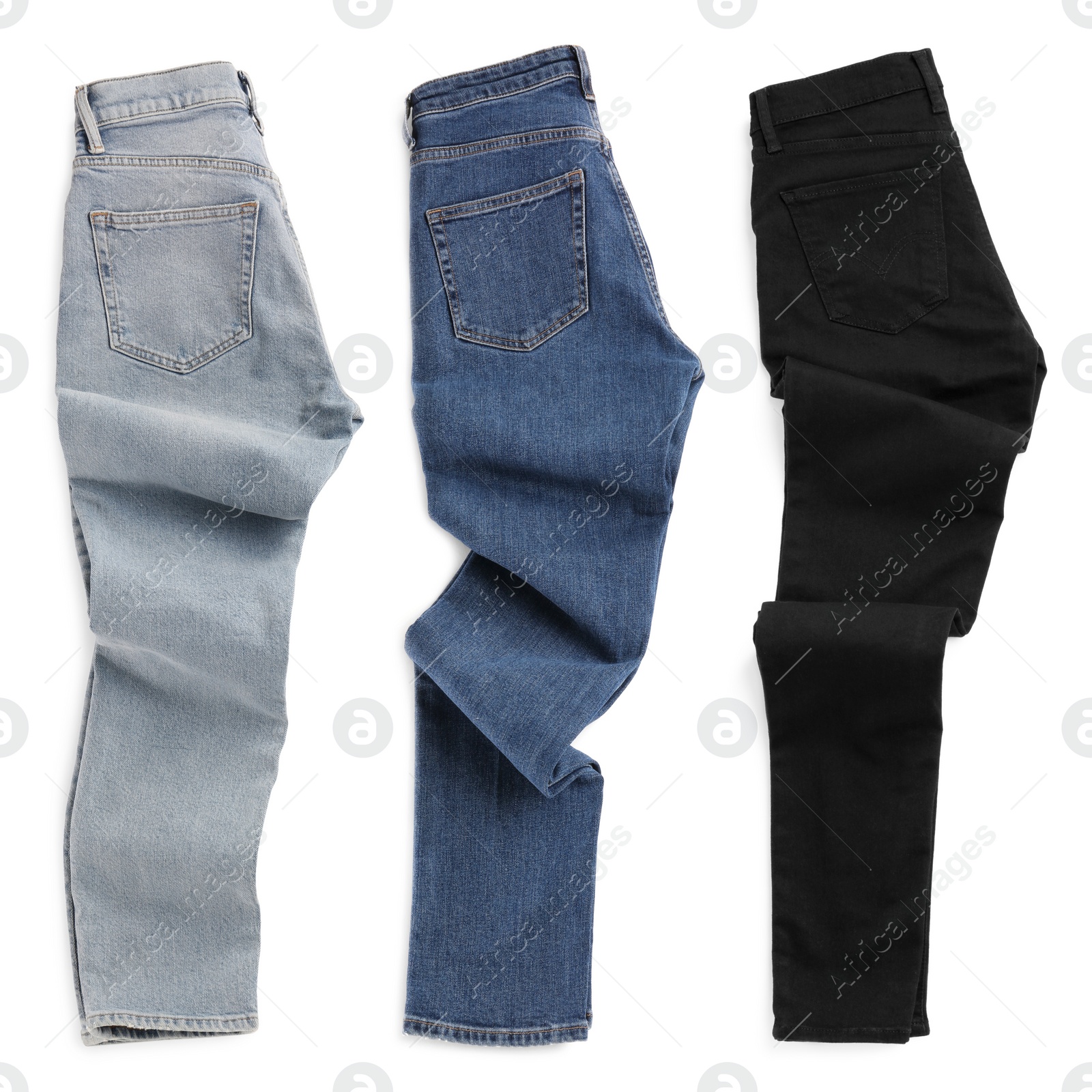 Image of Set with different jeans on white background, top view