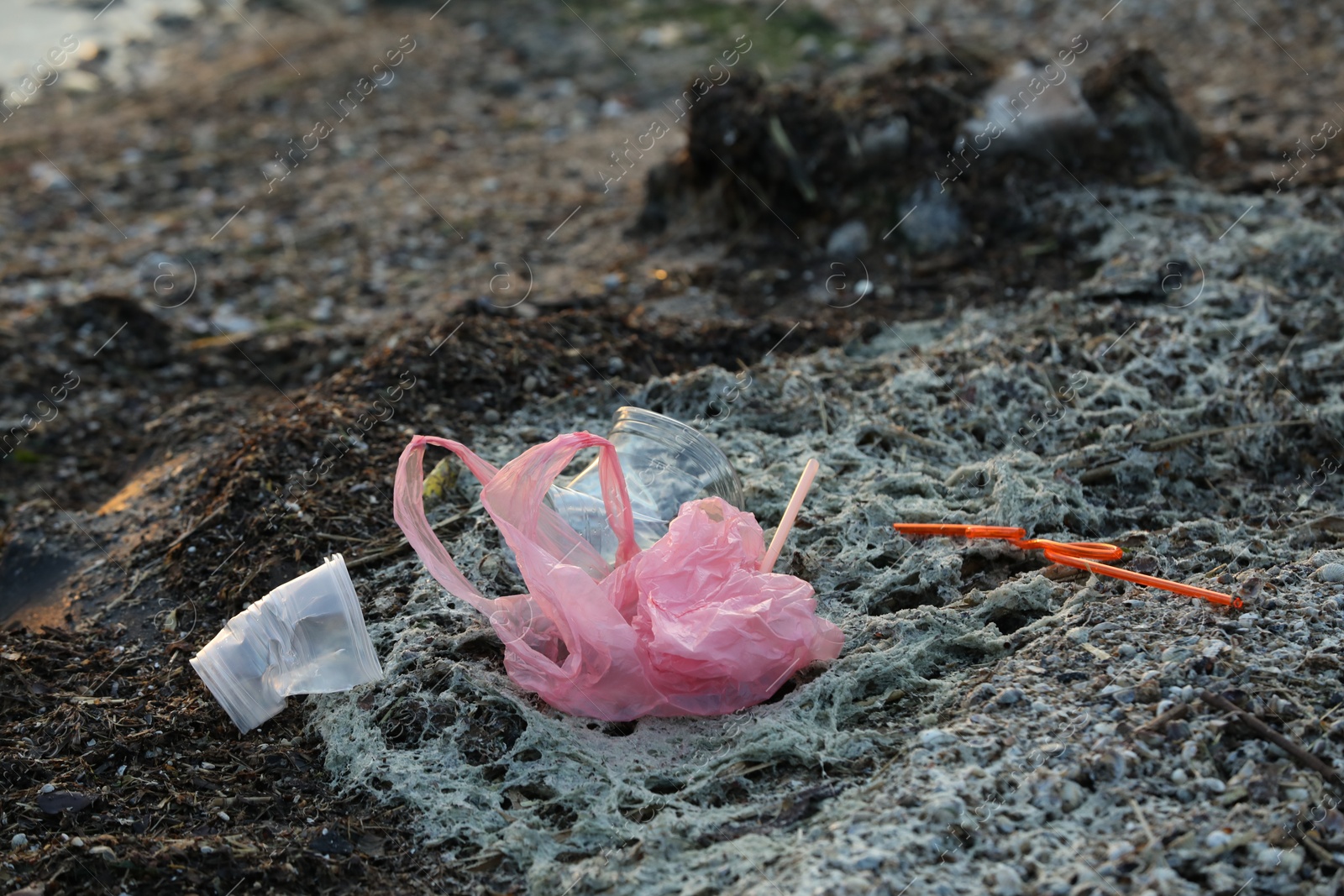 Photo of Plastic garbage at beach. Environmental pollution concept