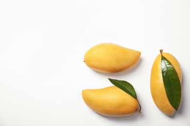 Photo of Composition with fresh mango fruits on white background, top view. Space for text