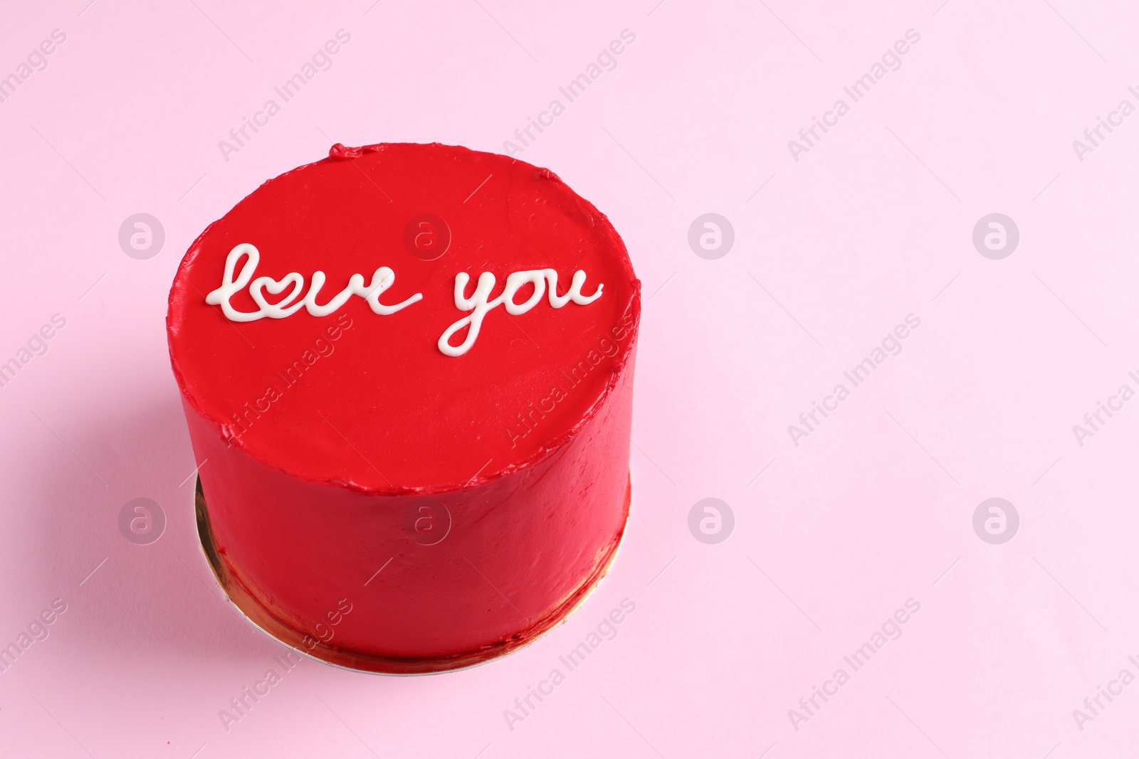 Photo of Bento cake with text Love You on pink table, space for text. St. Valentine's day surprise