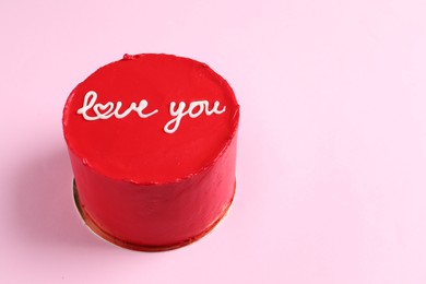 Photo of Bento cake with text Love You on pink table, space for text. St. Valentine's day surprise