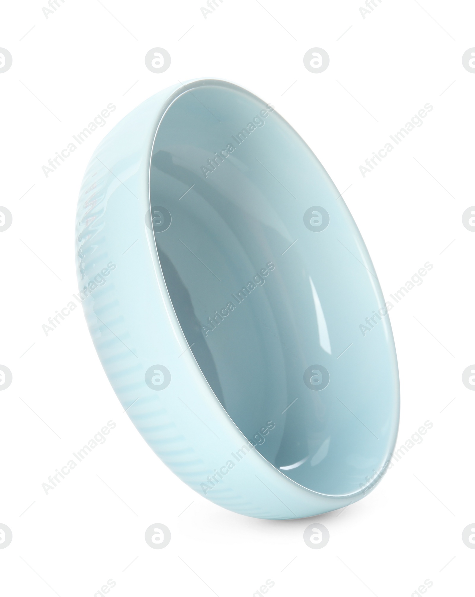 Photo of Clean light blue bowl isolated on white