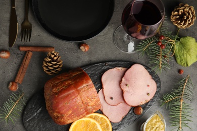 Photo of Flat lay composition with delicious ham on grey table. Christmas dinner