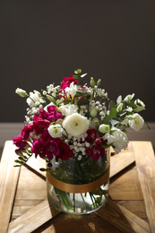 Photo of Beautiful sunlit bouquet with spring freesia flowers indoors