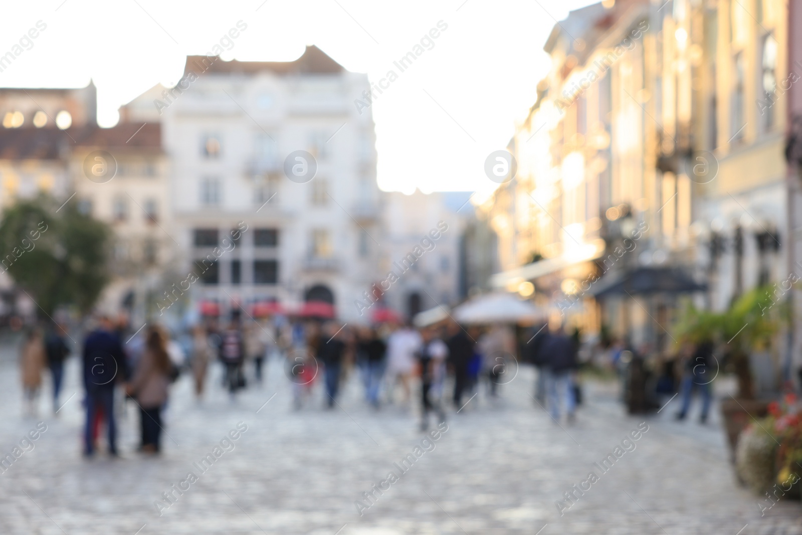 Photo of Blurred view of people walking on city street