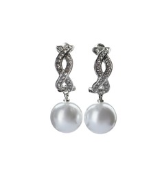 Photo of Elegant silver earrings with pearls on white background