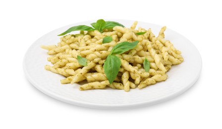 Photo of Plate of delicious trofie pasta with pesto sauce and basil leaves isolated on white