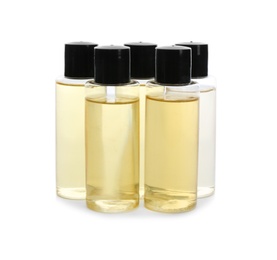 Photo of Mini bottles with cosmetic products on white background. Hotel amenities