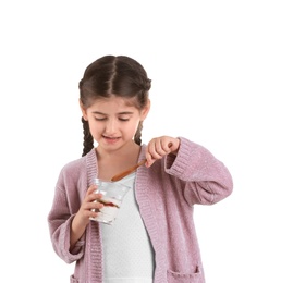 Photo of Little girl with yogurt on white background