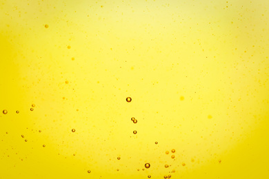 Photo of Cooking oil with bubbles as background, closeup
