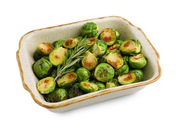 Photo of Delicious roasted Brussels sprouts and rosemary in baking dish isolated on white
