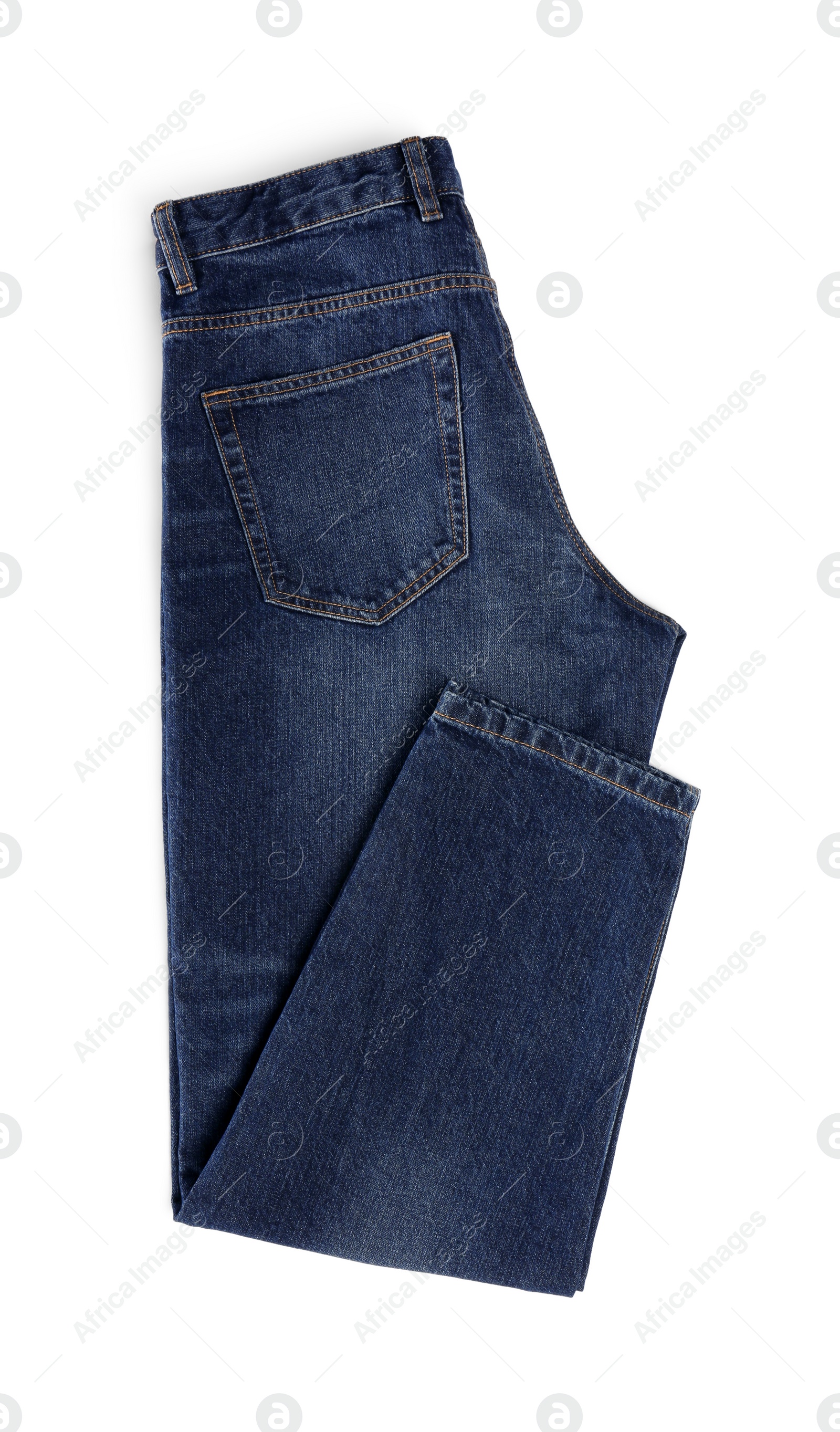 Photo of Stylish dark blue jeans isolated on white, top view