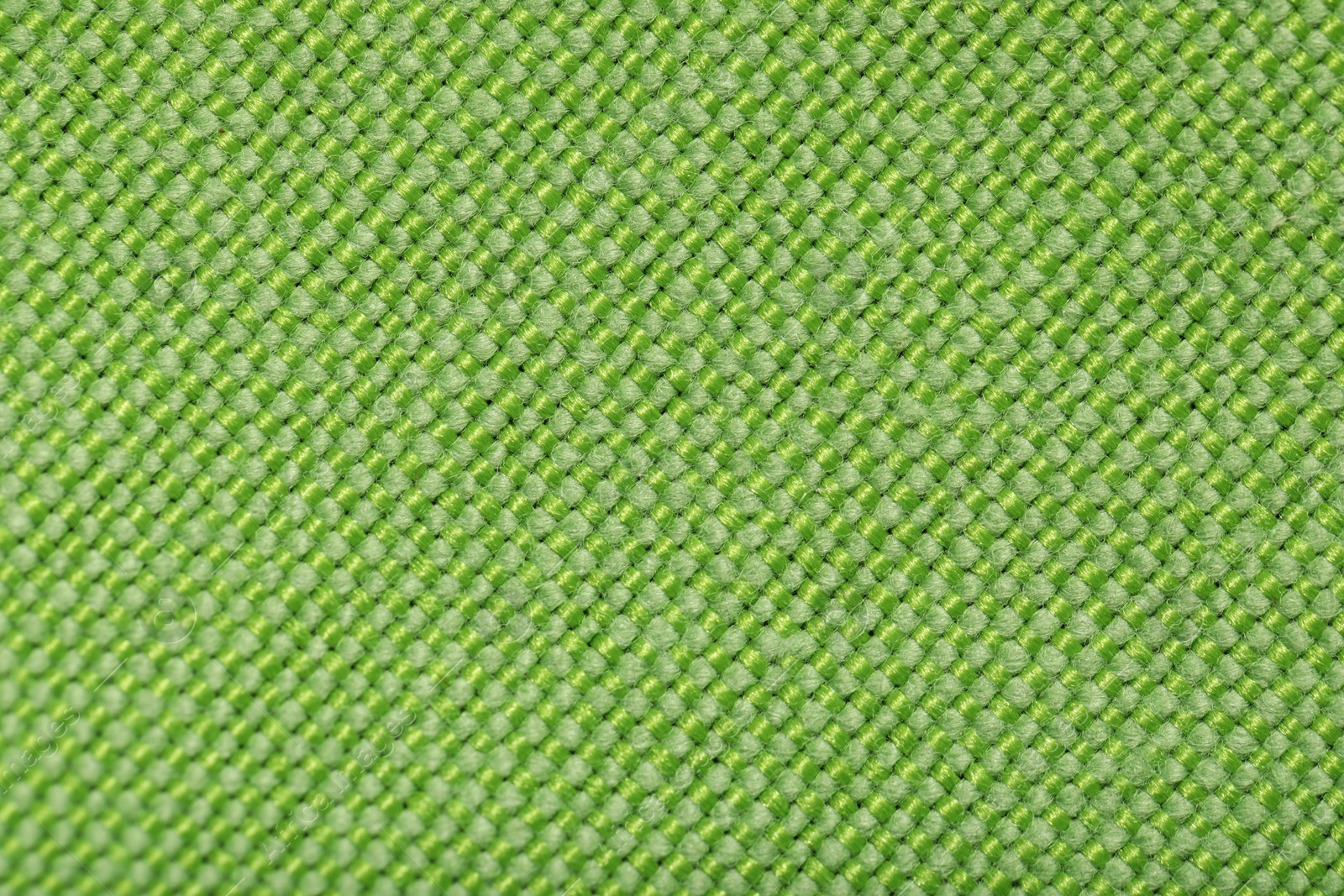 Photo of Texture of green fabric as background, top view