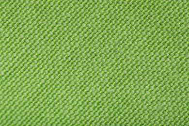 Photo of Texture of green fabric as background, top view