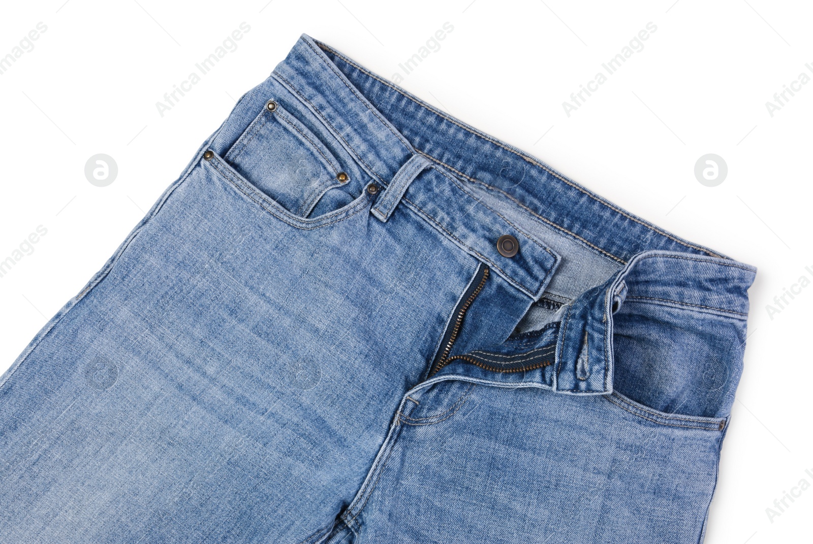 Photo of Stylish blue jeans isolated on white, top view