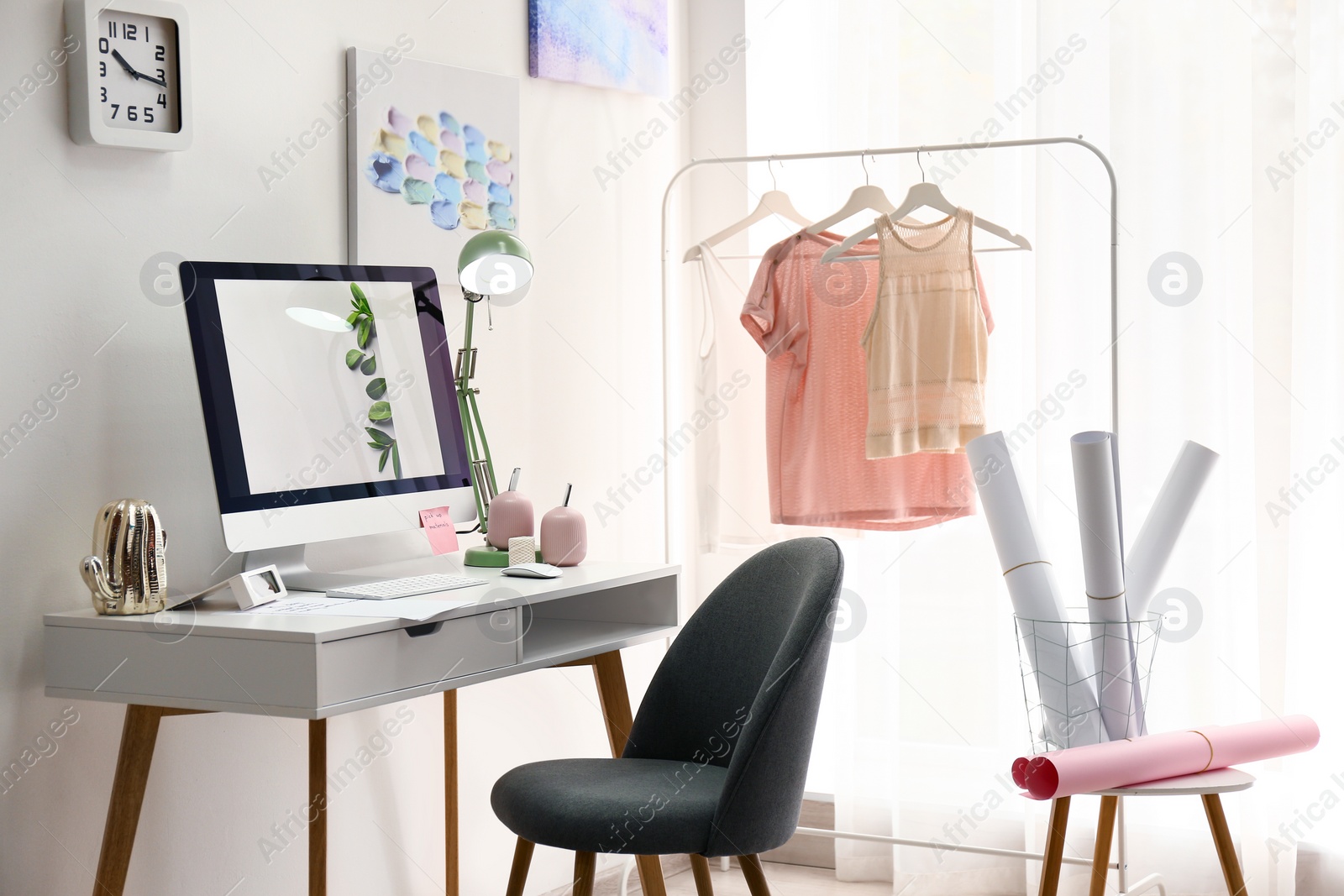 Photo of Designer's workplace with modern computer on table