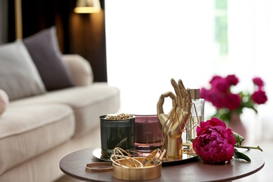 Photo of Composition with stylish accessories and interior elements on table indoors