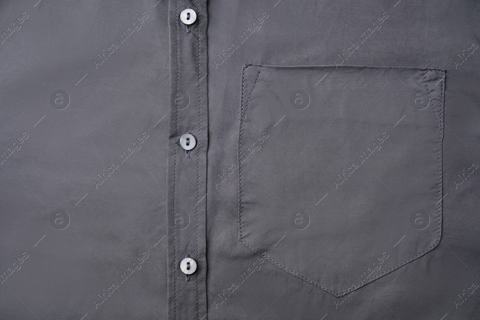 Photo of Gray shirt with pocket as background, top view