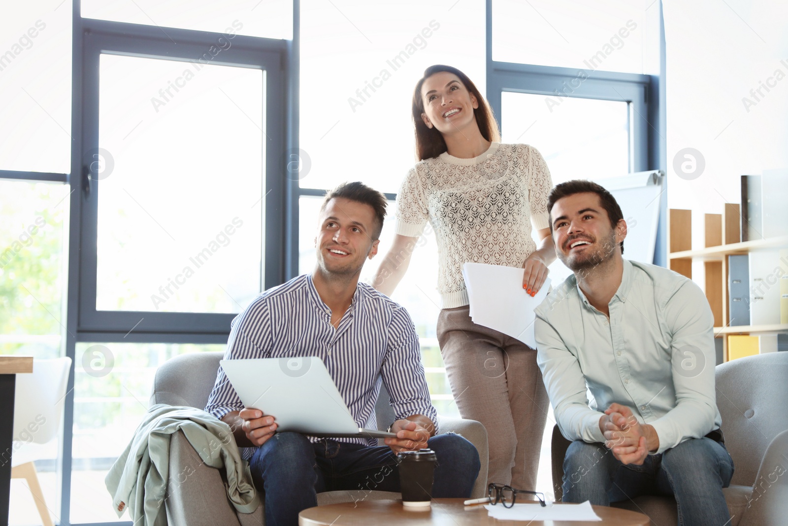 Photo of Office employees having business training at workplace