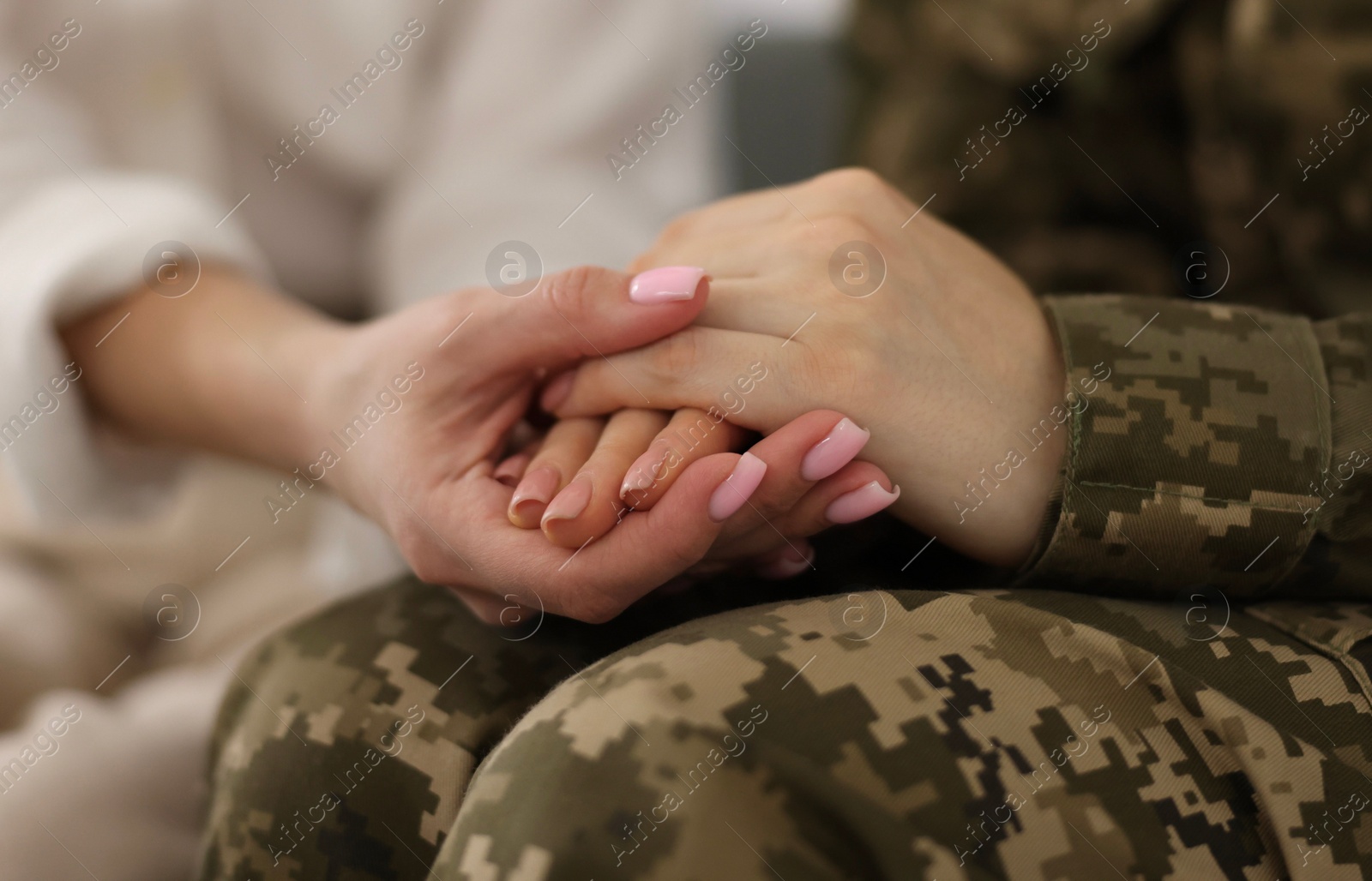 Photo of Psychotherapist working with military woman in office, closeup