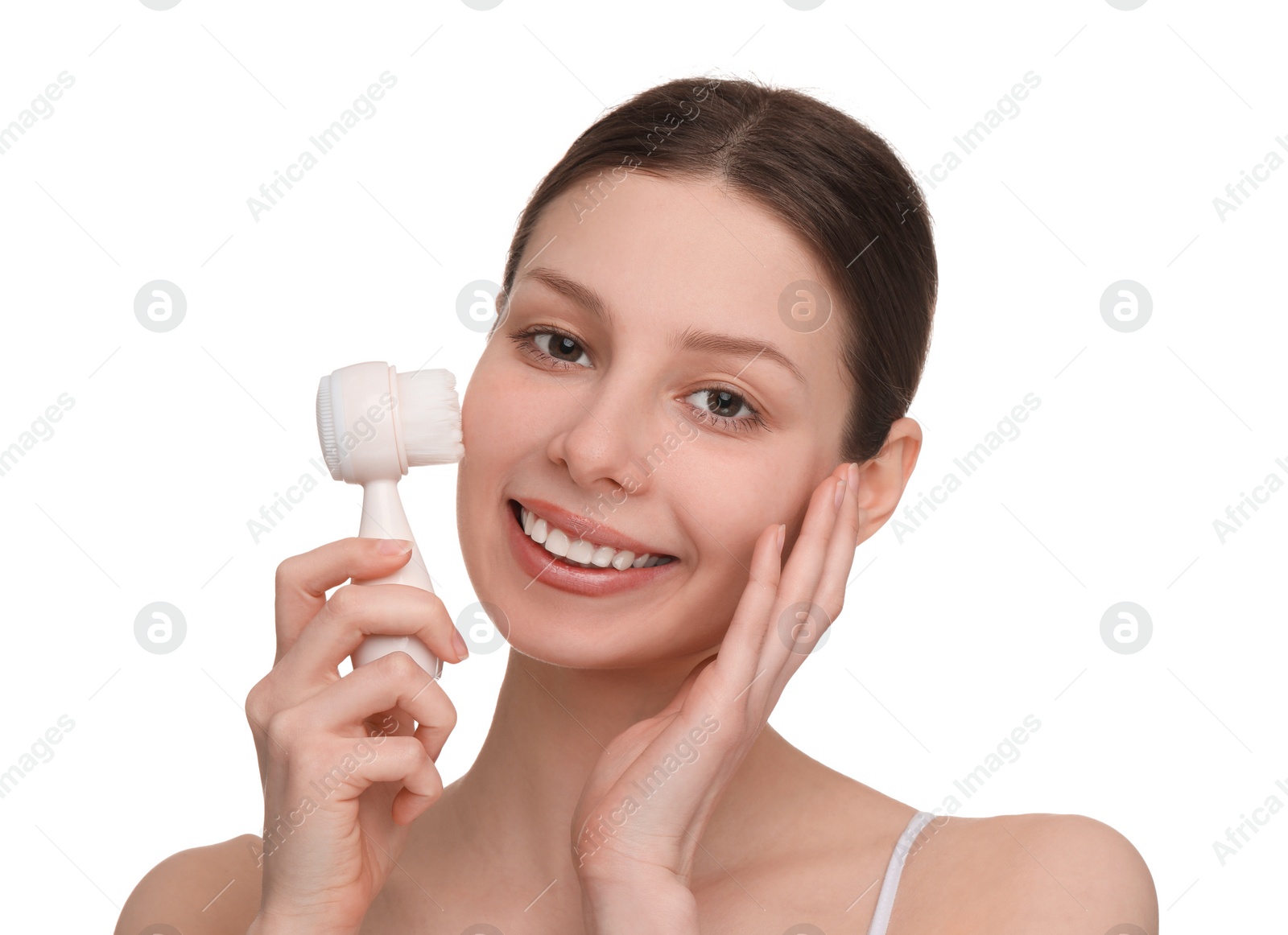 Photo of Washing face. Young woman with cleansing brush on white background