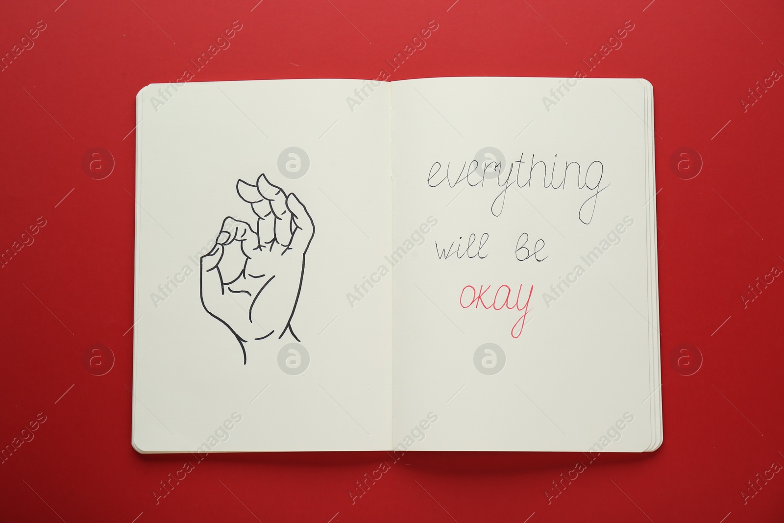 Photo of Notebook with phrase Everything Will Be Okay and drawing of hand showing gesture on red background, top view