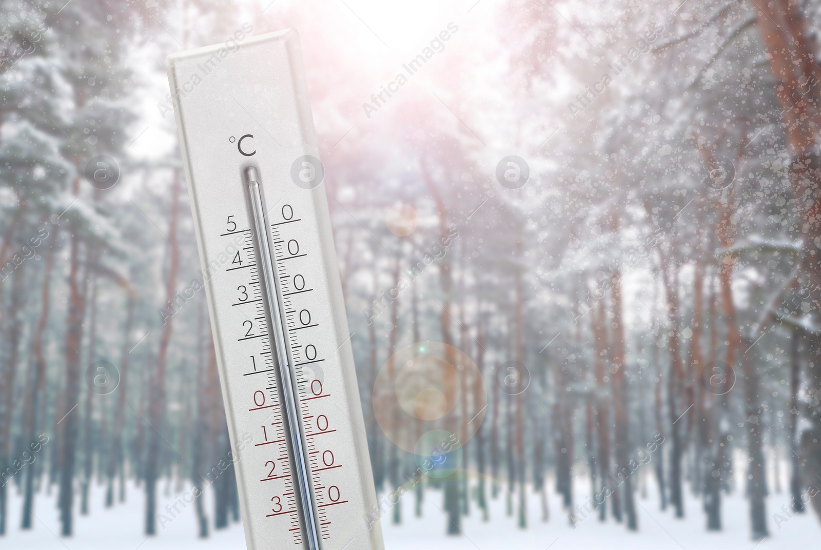 Image of Thermometer showing temperature below zero outdoors on winter day