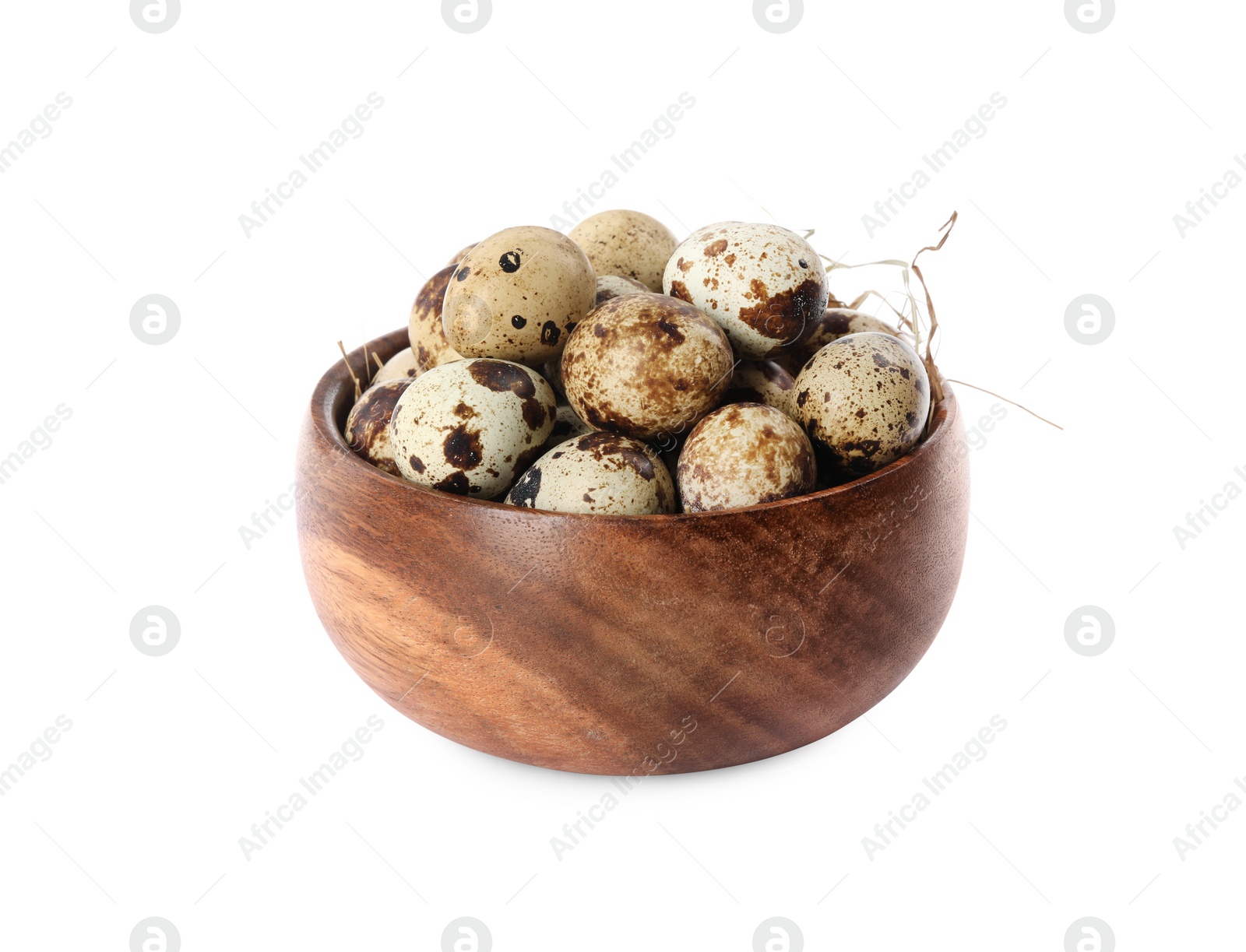 Photo of Wooden bowl with quail eggs and straw isolated on white