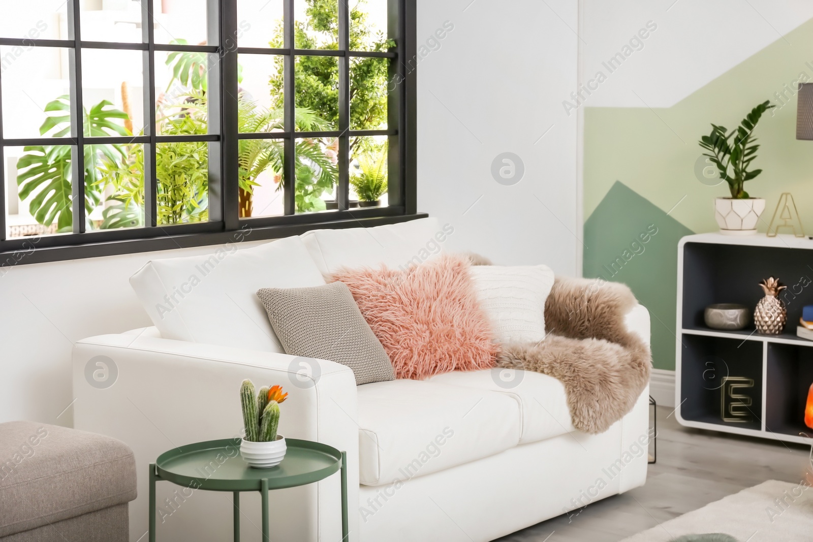 Photo of Stylish living room interior with comfortable sofa