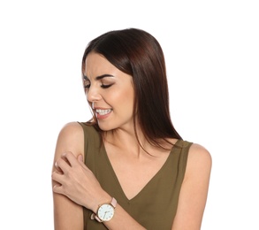 Photo of Young woman scratching skin on white background. Annoying itch