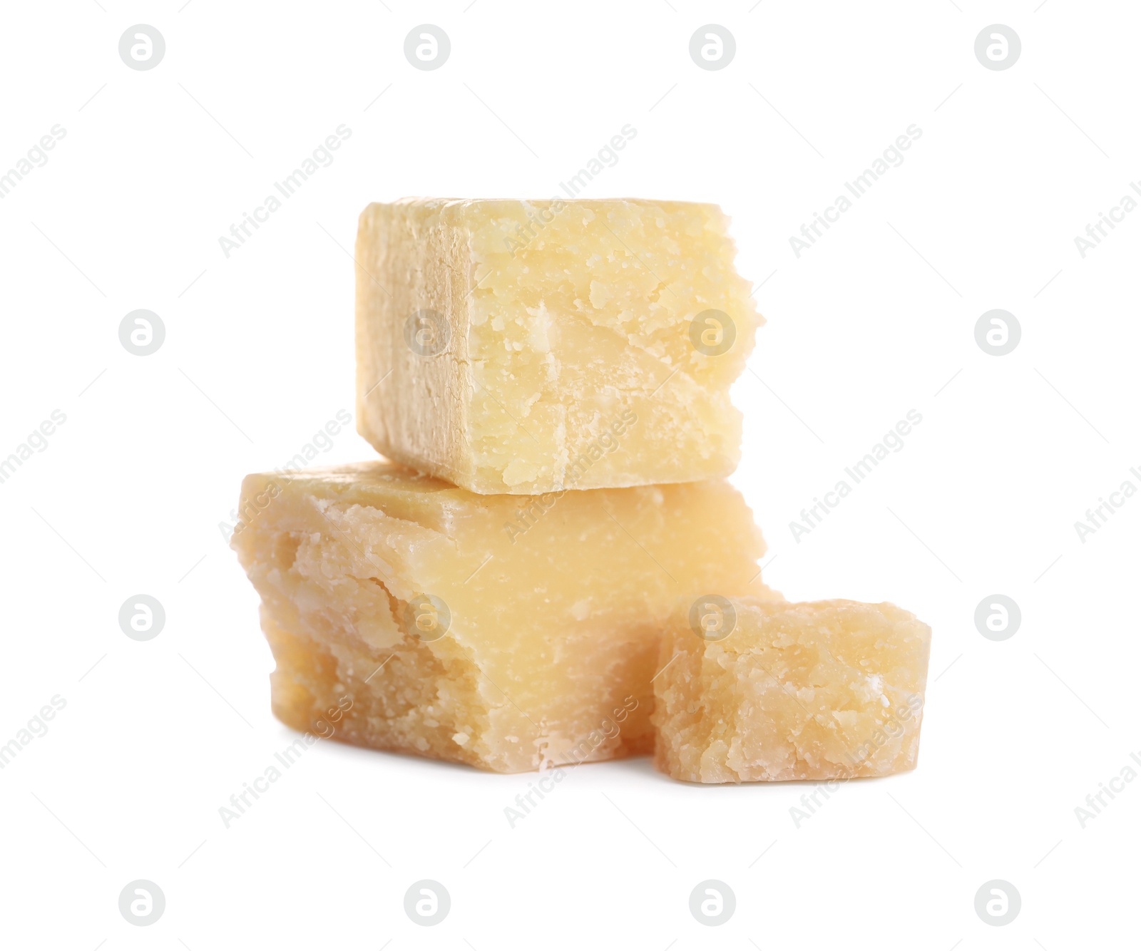 Photo of Pieces of delicious parmesan cheese on white background