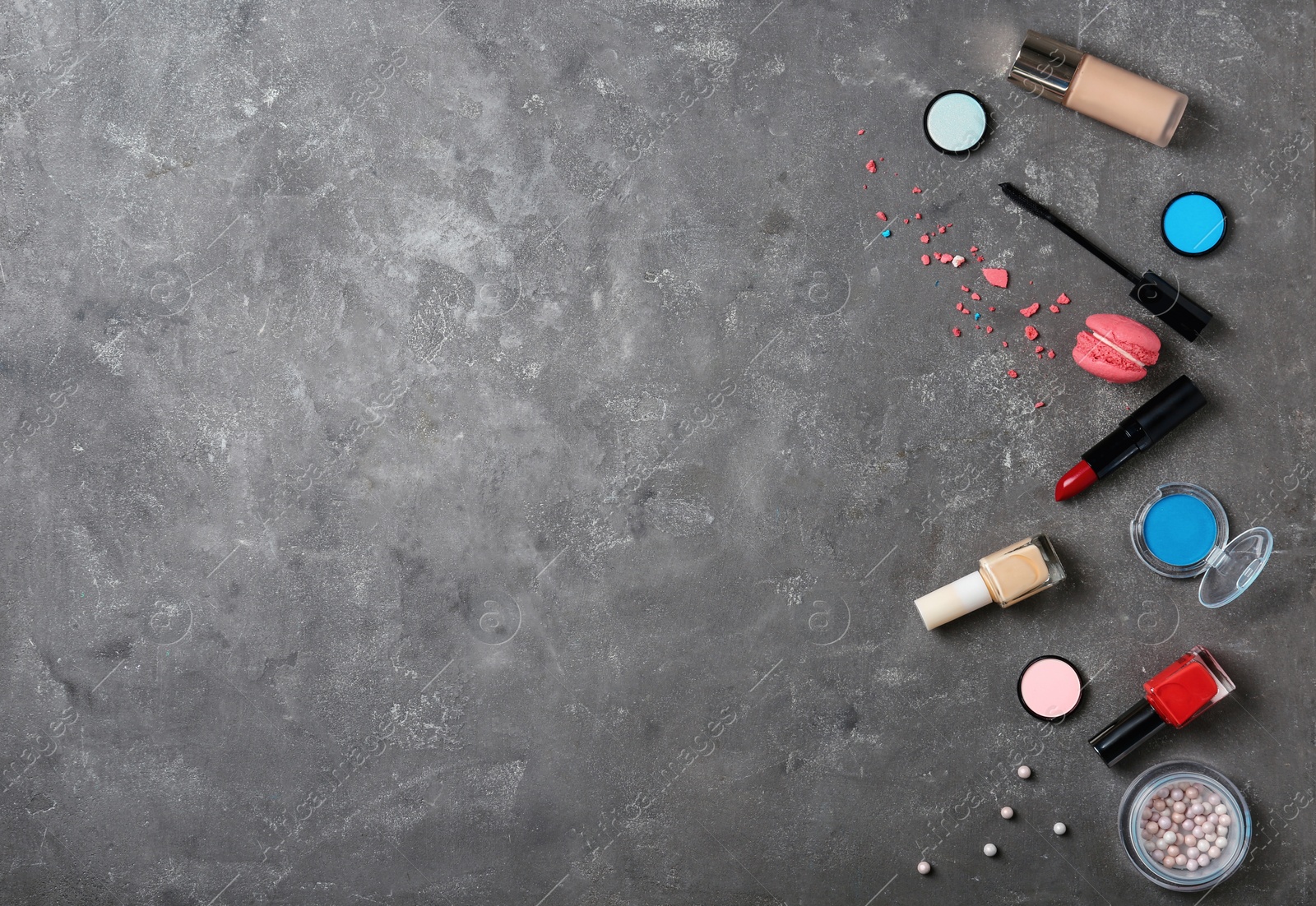 Photo of Flat lay composition with professional makeup products on grey background