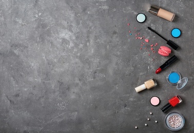 Photo of Flat lay composition with professional makeup products on grey background